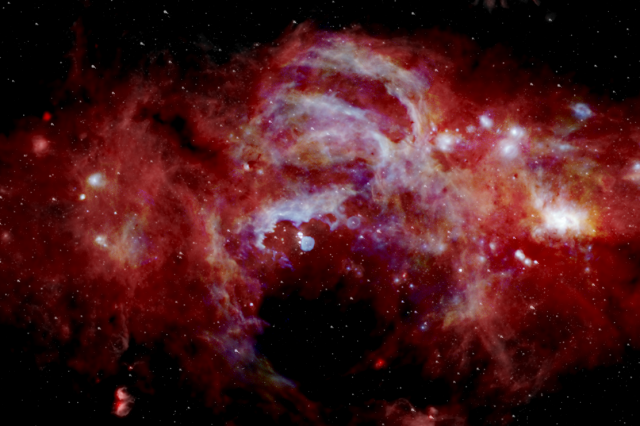Composite infrared image of the center of our Milky Way galaxy, which spans over 600 light-years. Credits: NASA/SOFIA/JPL-Caltech/ESA/Herschel.